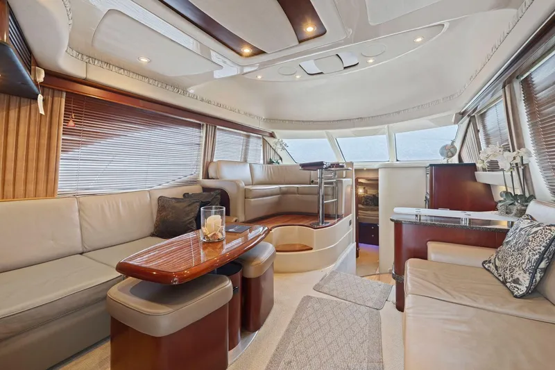 Slide: The Image of Luxurious interior of 2005 Sea Ray 420 Sedan Bridge yacht with elegant seating and decor. - 5