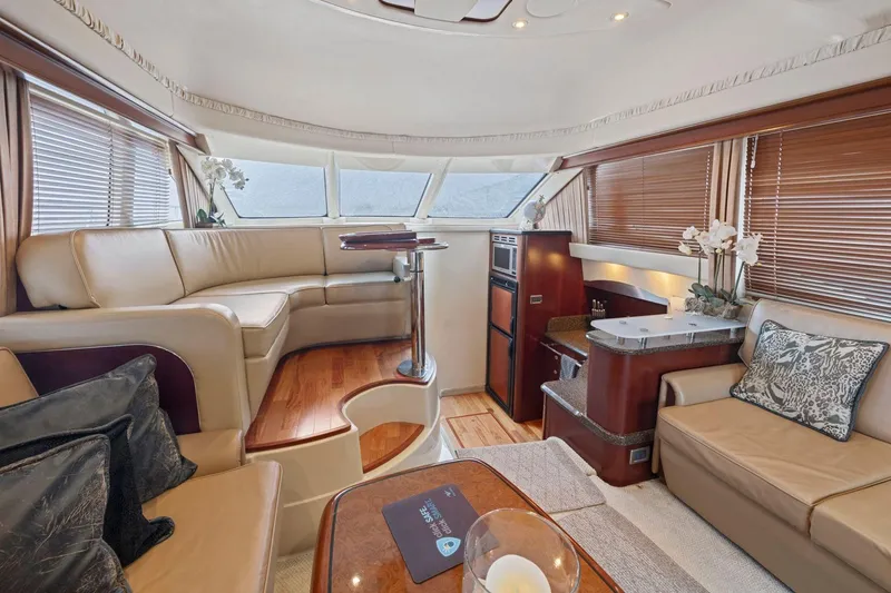 Slide: The Image of Luxurious interior of 2005 Sea Ray 420 Sedan Bridge yacht with elegant seating and decor. - 7