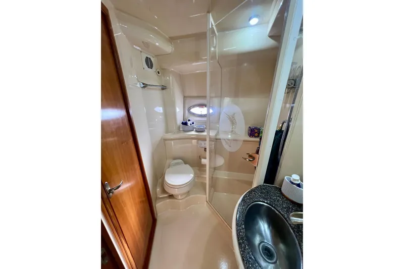 Slide: The Image of Bathroom interior of 2004 Meridian 408 Motoryacht with shower, sink, and toilet. - 10