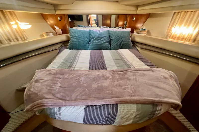 Slide: The Image of Luxurious bedroom interior of 2004 Meridian 408 Motoryacht with cozy bedding and ambient lighting. - 11