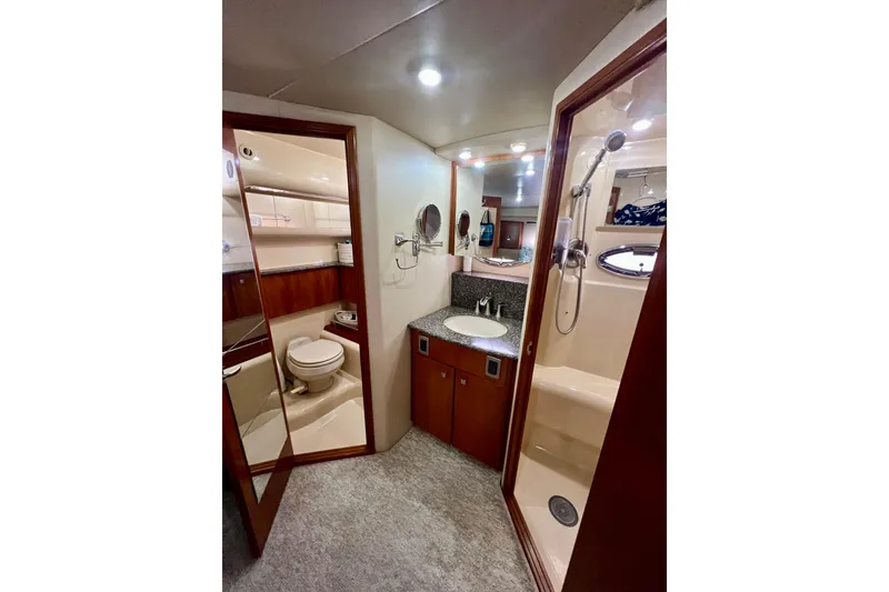 Slide: The Image of Luxurious bathroom in 2004 Meridian 408 Motoryacht with shower, sink, and toilet. - 18