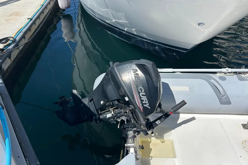 Slide: The Image of Outboard motor on inflatable boat near 2004 Meridian 408 Motoryacht at dock. - 22