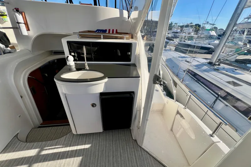 Slide: The Image of 2004 Meridian 408 Motoryacht interior with sink, countertop, and marina view. - 3