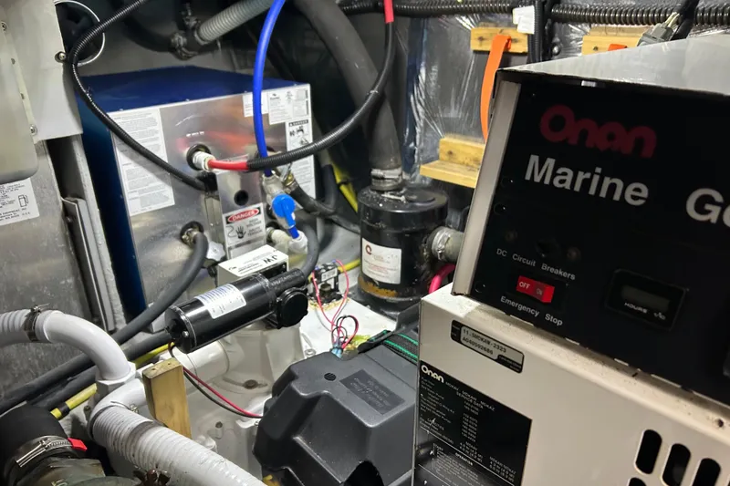 Slide: The Image of Engine room of 2004 Meridian 408 Motoryacht with Onan marine generator and wiring. - 33