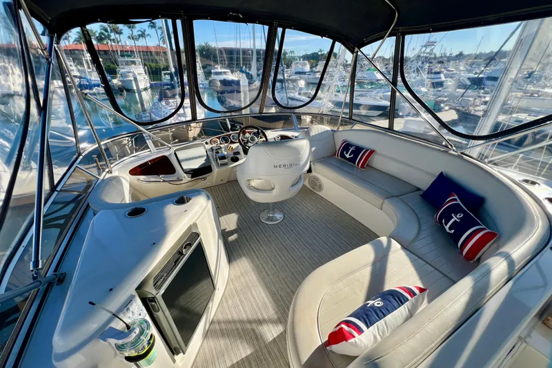 Slide: The Image of Luxurious 2004 Meridian 408 Motoryacht interior with helm, seating, and nautical decor. - 5