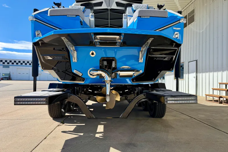 Slide: The Image of 2026 Nautique Super Air Nautique G23 Paragon boat on trailer, rear view. - 10