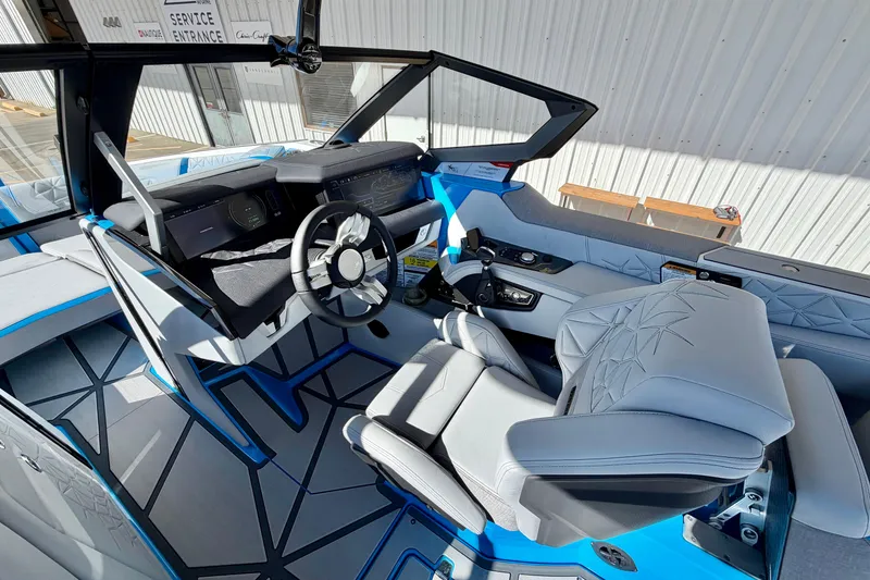 Slide: The Image of Interior of 2026 Nautique Super Air Nautique G23 Paragon boat, featuring modern design and controls. - 16