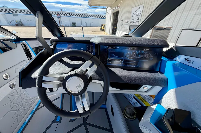 Slide: The Image of Interior view of 2026 Nautique Super Air Nautique G23 Paragon boat dashboard. - 17