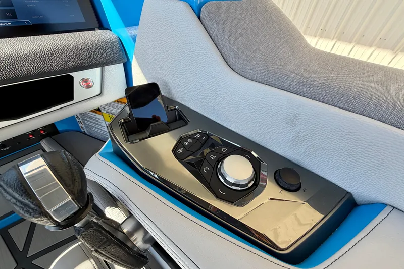 Slide: The Image of Control panel of 2026 Nautique Super Air Nautique G23 Paragon boat interior. - 18