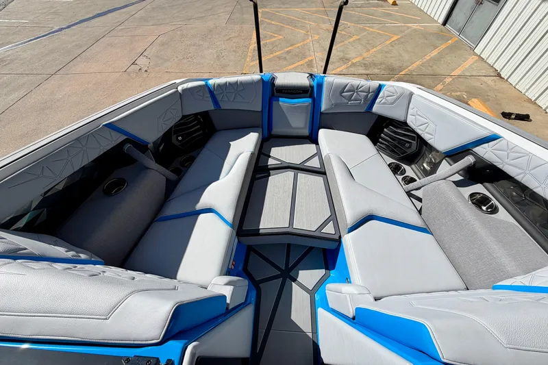 Slide: The Image of Interior of 2026 Nautique Super Air Nautique G23 Paragon boat, featuring luxurious seating. - 23