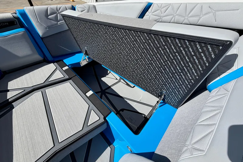 Slide: The Image of 2026 Nautique Super Air Nautique G23 Paragon interior with stylish seating and storage compartment. - 24