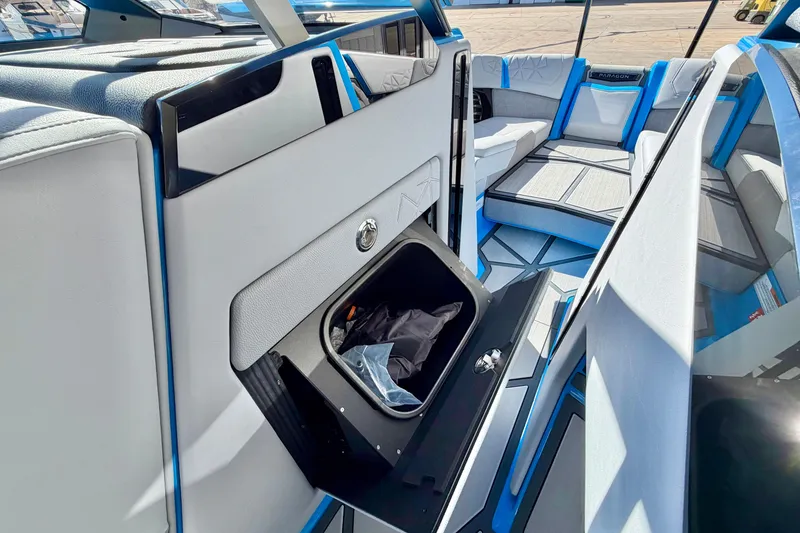 Slide: The Image of Interior of 2026 Nautique Super Air Nautique G23 Paragon, featuring sleek seating and storage. - 29