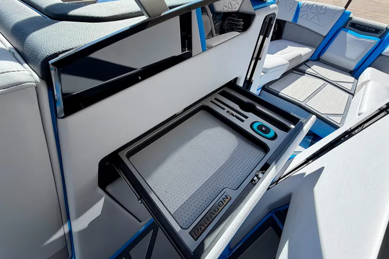 Slide: The Image of Interior of 2026 Nautique Super Air Nautique G23 Paragon boat with storage compartment. - 30
