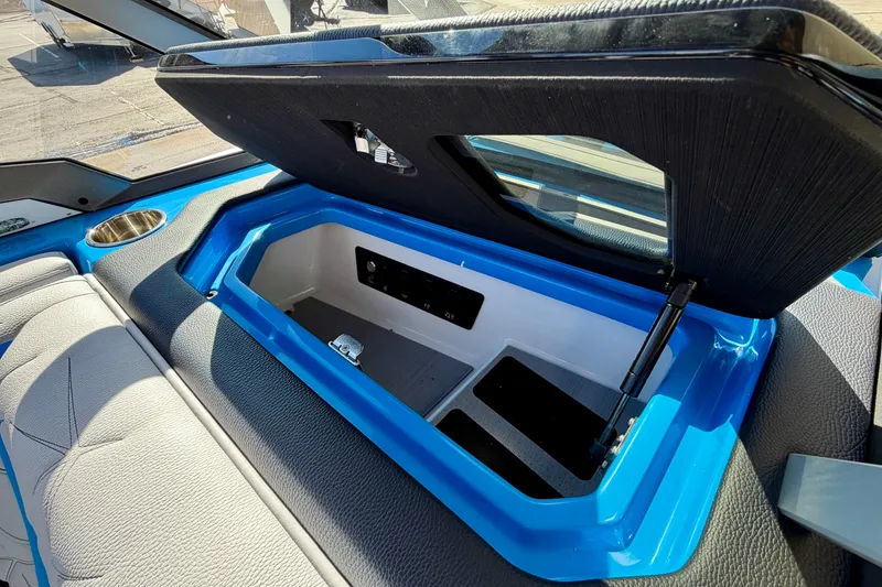 Slide: The Image of Open storage compartment in 2026 Nautique Super Air Nautique G23 Paragon boat interior. - 31