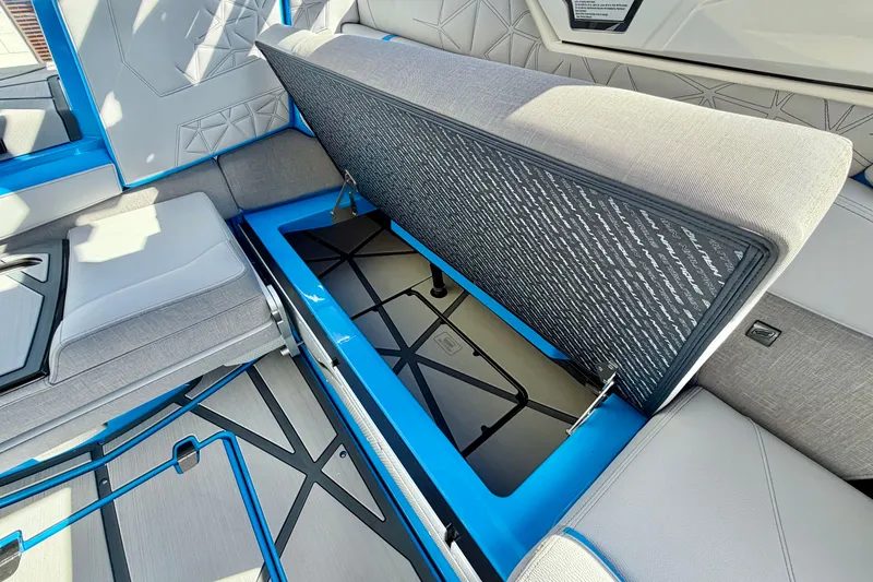 Slide: The Image of 2026 Nautique Super Air Nautique G23 Paragon interior storage compartment with blue accents. - 33