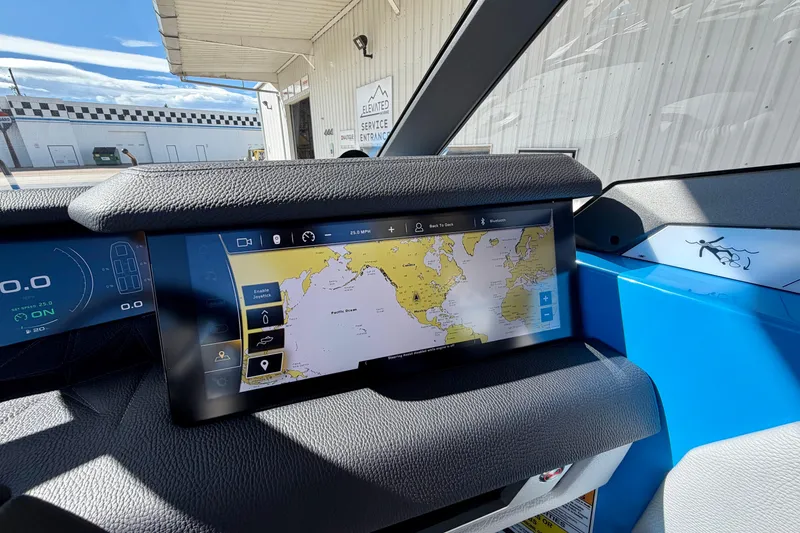 Slide: The Image of 2026 Nautique Super Air Nautique G23 Paragon dashboard with navigation display. - 40