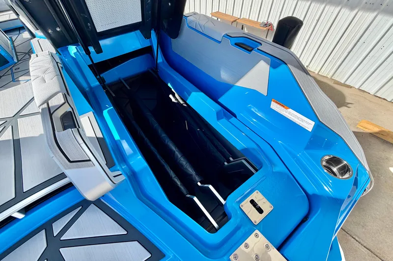 Slide: The Image of 2026 Nautique Super Air Nautique G23 Paragon boat interior storage compartment, blue and gray design. - 43