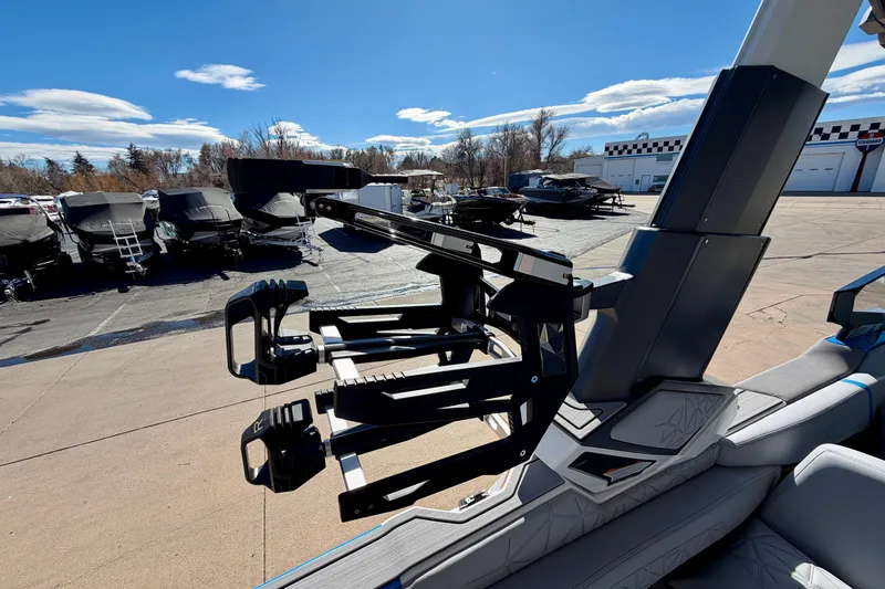 Slide: The Image of 2026 Nautique Super Air Nautique G23 Paragon boat with advanced wakeboard rack. - 44