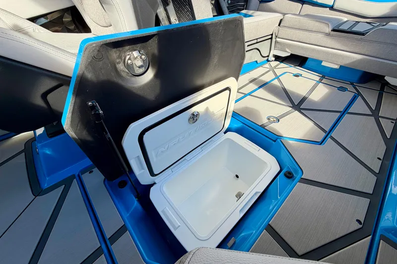 Slide: The Image of 2026 Nautique Super Air Nautique G23 Paragon interior with open storage compartment. - 49