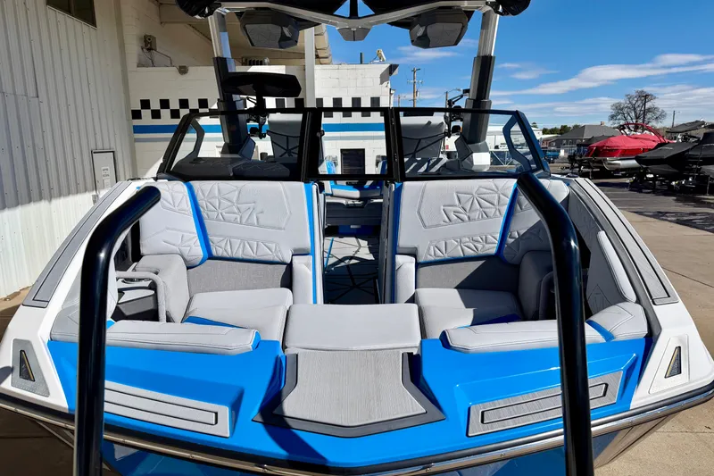 Slide: The Image of 2026 Nautique Super Air Nautique G23 Paragon boat with sleek blue and gray interior design. - 7