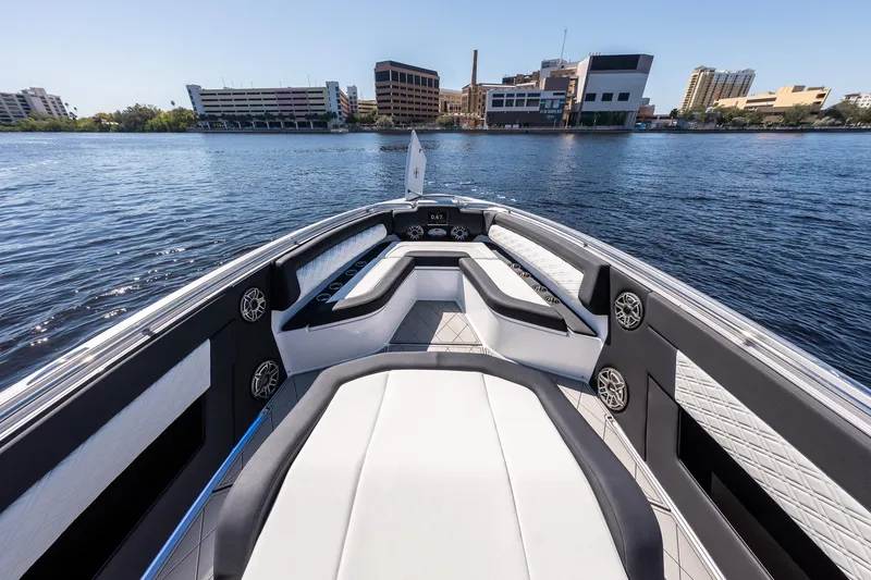 Slide: The Image of 2022 Cigarette 41 Nighthawk boat interior with waterfront cityscape background. - 3
