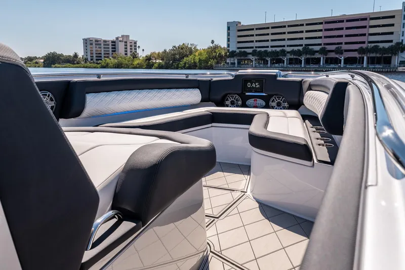 Slide: The Image of 2022 Cigarette 41 Nighthawk luxury boat interior with modern seating and dashboard. - 6