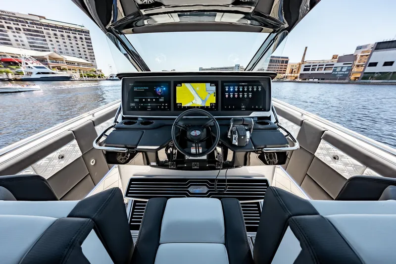 Slide: The Image of 2022 Cigarette 41 Nighthawk boat cockpit with advanced navigation system. - 9