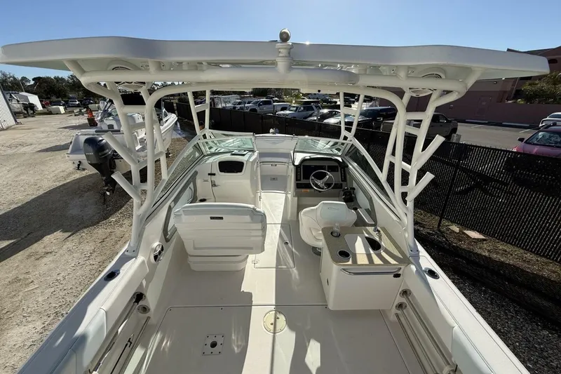 Slide: The Image of 2018 Robalo R247 Dual Console boat interior with seating and steering wheel. - 6