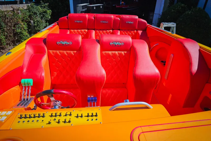 Slide: The Image of Luxurious 2005 Outerlimits 51 Sport Yacht with vibrant red and orange interior. - 17