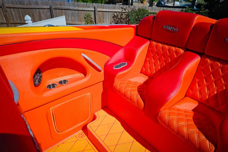 Slide: The Image of Luxurious orange and red interior of a 2005 Outerlimits 51 Sport Yacht. - 21