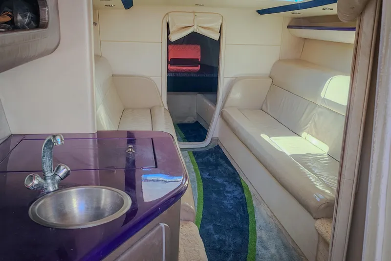 Slide: The Image of Interior of 2005 Outerlimits 51 Sport Yacht with seating and kitchenette. - 22
