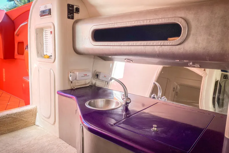 Slide: The Image of Interior of 2005 Outerlimits 51 Sport Yacht with sleek kitchenette and modern design. - 23