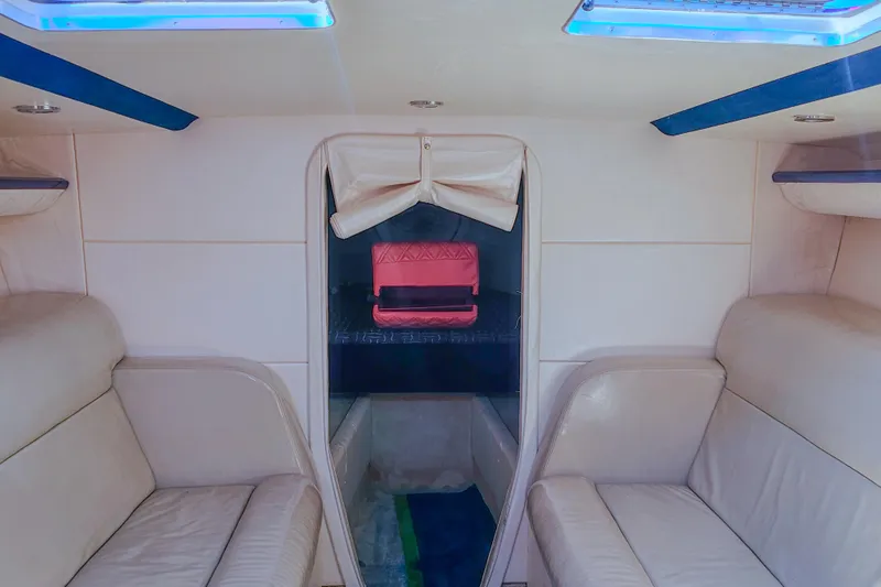 Slide: The Image of Interior of 2005 Outerlimits 51 Sport Yacht with beige seating and skylights. - 24