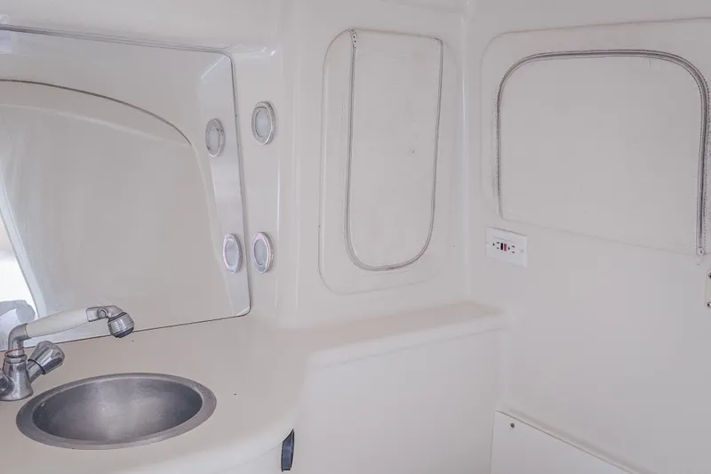Slide: The Image of Interior of 2005 Outerlimits 51 Sport Yacht bathroom with sink and mirror. - 28