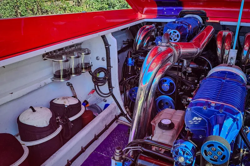 Slide: The Image of Engine compartment of a 2005 Outerlimits 51 Sport Yacht with polished components. - 31