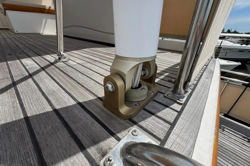 Slide: The Image of Deck detail of 1989 Grand Banks 42 Motor Yacht, showcasing sturdy railing and fittings. - 28