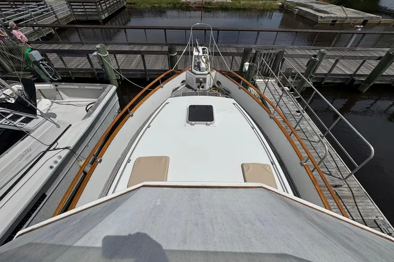 Slide: The Image of 1989 Grand Banks 42 Motor Yacht docked at marina, top deck view. - 33