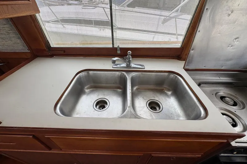 Slide: The Image of Double sink in 1989 Grand Banks 42 Motor Yacht kitchen area. - 52