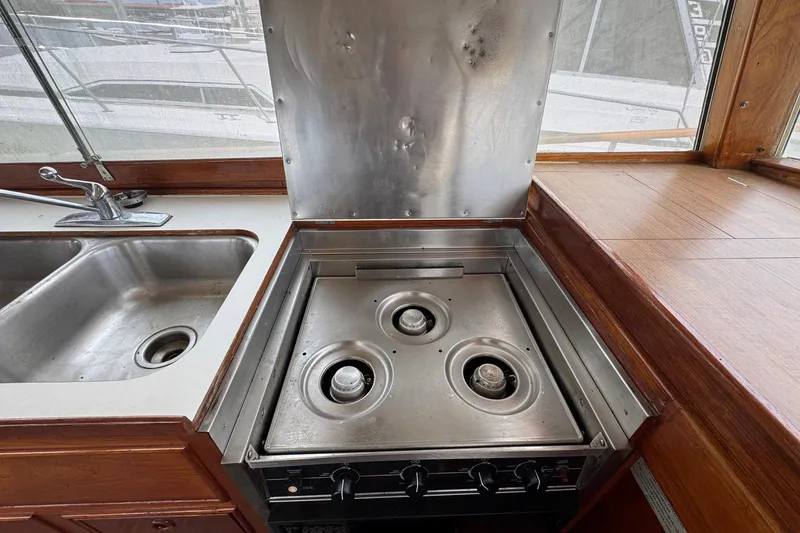 Slide: The Image of Galley kitchen in 1989 Grand Banks 42 Motor Yacht with stove and sink. - 53