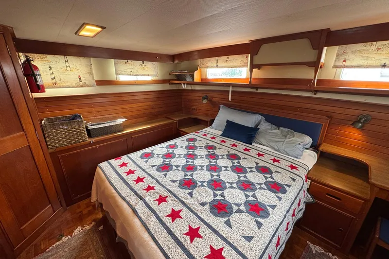 Slide: The Image of Cozy bedroom in 1989 Grand Banks 42 Motor Yacht with nautical decor and quilted bedding. - 71