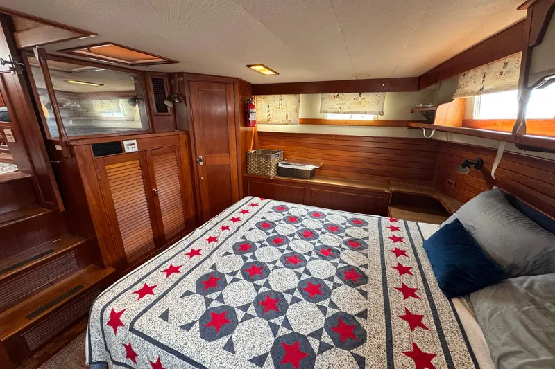 Slide: The Image of Cozy bedroom in 1989 Grand Banks 42 Motor Yacht with star-patterned quilt. - 72