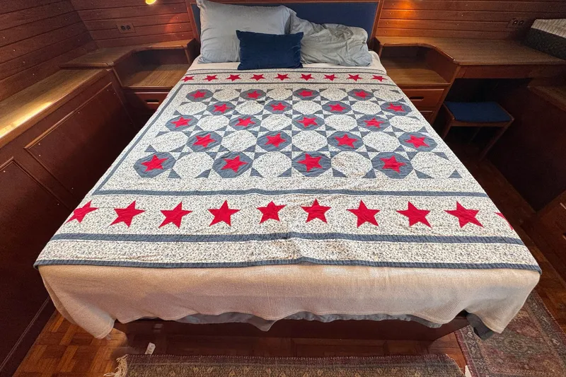 Slide: The Image of Bed with star-patterned quilt in 1989 Grand Banks 42 Motor Yacht cabin. - 75