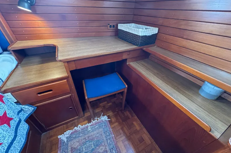 Slide: The Image of Cozy wooden interior of 1989 Grand Banks 42 Motor Yacht with desk and chair. - 76