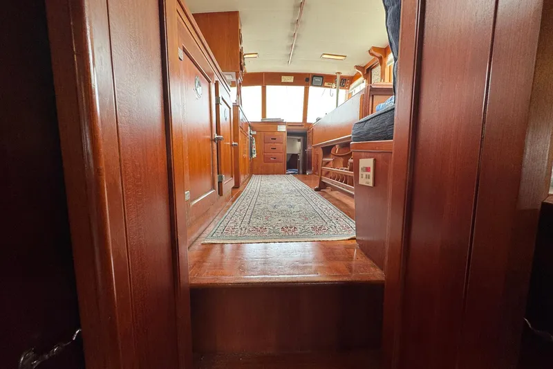 Slide: The Image of Interior of 1989 Grand Banks 42 Motor Yacht with wooden cabinetry and carpeted floor. - 79