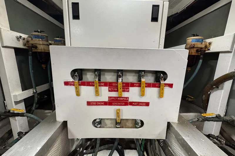 Slide: The Image of Engine room of 1989 Grand Banks 42 Motor Yacht with fuel manifold controls. - 87