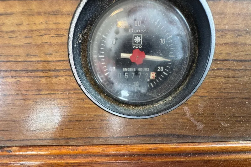 Slide: The Image of Analog engine hour meter on 1989 Grand Banks 42 Motor Yacht dashboard. - 96