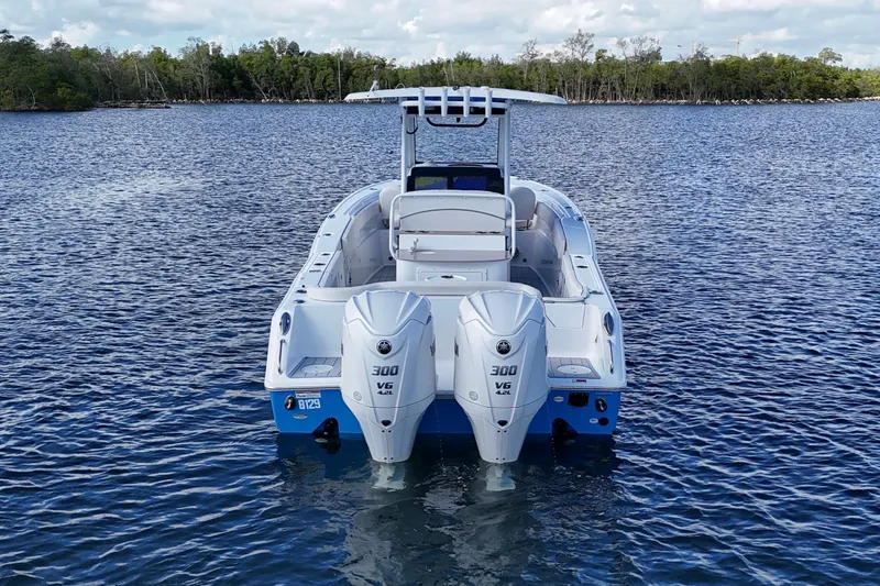 Slide: The Image of 2023 Sea Hunt Ultra 305 SE boat on water with dual engines. - 5