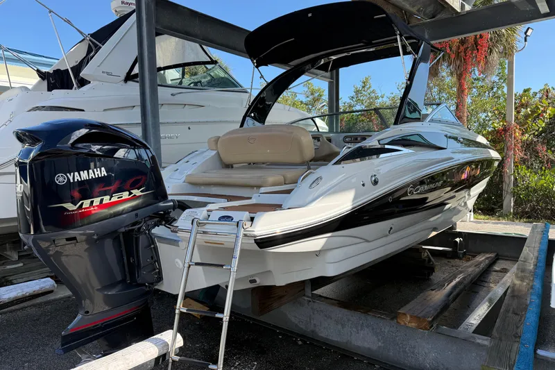 The Image of 2018 Crownline Eclipse E24 XS boat docked, sunny day. - 0