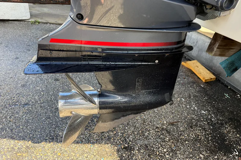 Slide: The Image of 2018 Crownline Eclipse E24 XS boat on trailer, sleek design, white and black exterior. - 13