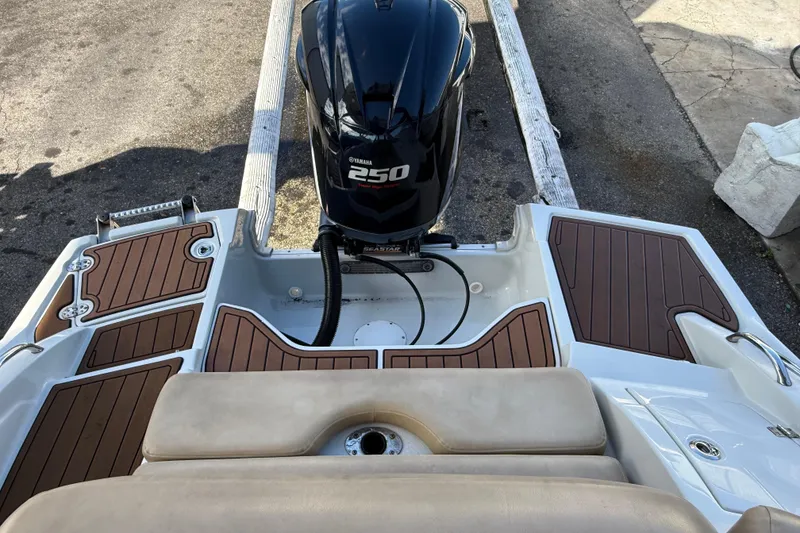 Slide: The Image of 2018 Crownline Eclipse E24 XS boat motor and propeller close-up. - 14